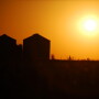 grain bins at sunset