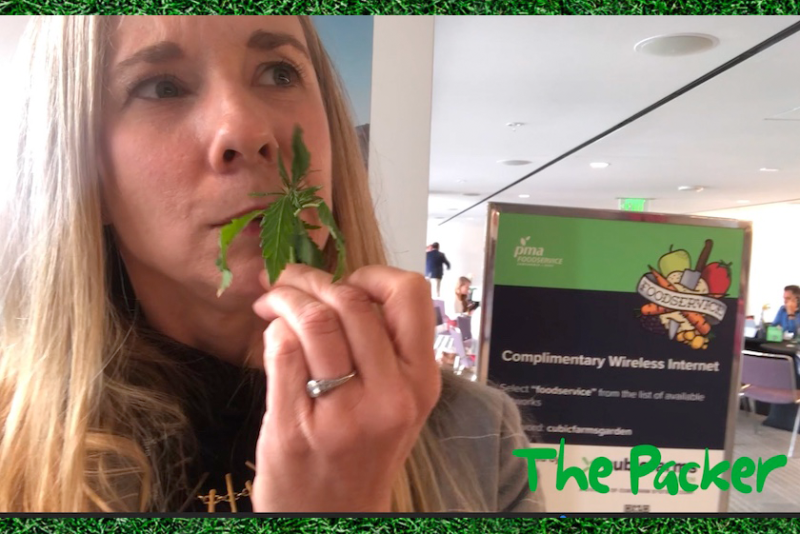 The Packer's Northeast editor Amy Sowder samples organic baby hemp greens at PMA Foodservice Show in Monterey, Calif.