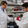 Andrew Curtis (right), doctoral research assistant works in the laboratory with Hans Coetzee (left), professor and head of the anatomy and physiology department.