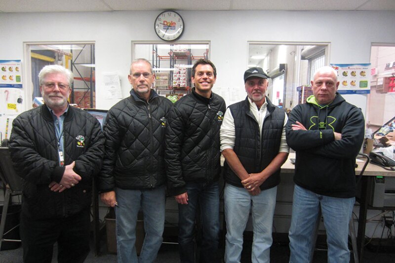 CEO Mark Levin (from left) and salesmen Brian Kriebel, Ryan Miller, Pete Gabriele and Joe Armata help move about 35,000 cases of bananas each week at M. Levin and Co., a fixture on the Philadelphia Wholesale Produce Market, says Tracie Levin, controller. The company also handles a variety of tropical items, fruits, vegetables and other food products.