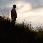 Farmer standing in field mental health