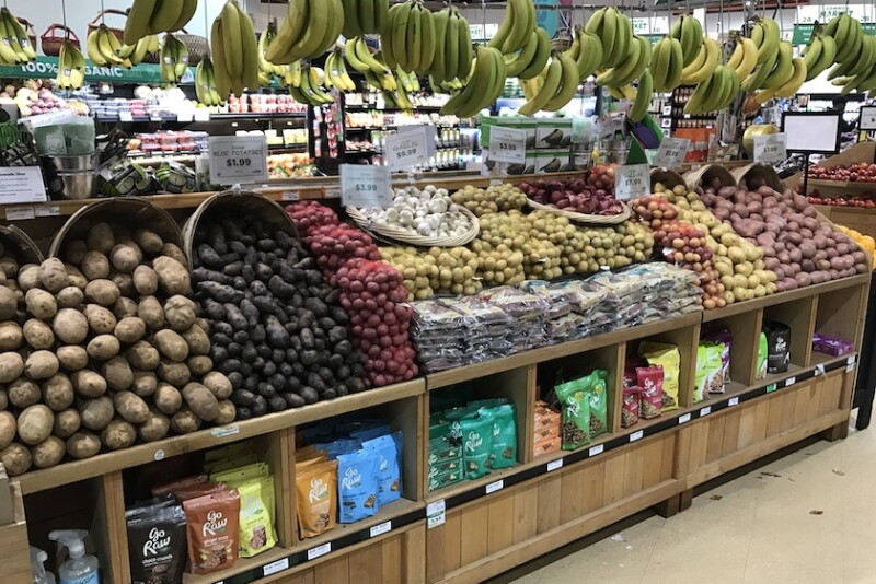 potato display supermarket hanging bananas