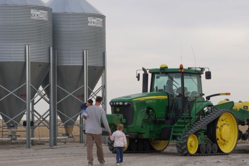 Nate Huntley and kids on farm