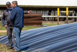 UC Davis Professor, Frank Mitloehner next to anaerobic digester on a swine farm.