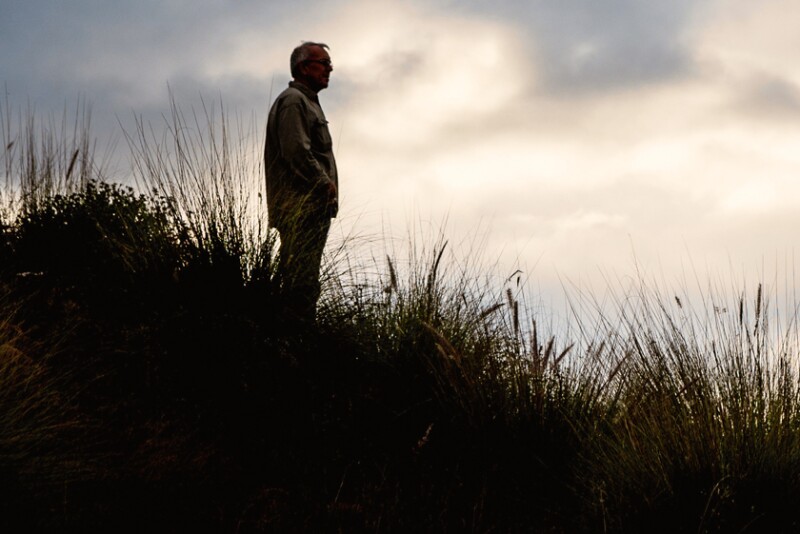 Farmer standing in field mental health