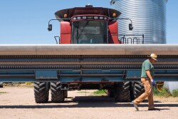 Farmer Roy Pfaltzgraff and Combine