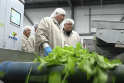 U.S. Agriculture Secretary Sonny Perdue, (foreground), visits with Lef Farms President Henry Huntington at the greenhouse company in Loudon, N.H., in early September during a “Back to Our Roots” RV tour. Perdue and USDA staff are again traveling in an RV this week, with plans to visit Mastronardi Produce in Coldwater, Mich.