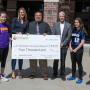 USApple board chairwoman Kaari Stannard, president of New York Apple Sales, presents the Rensselaer City School District with a 2019 Apples4Ed grant.