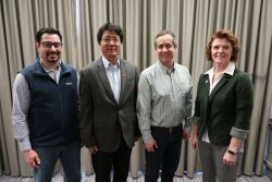 L to R: Edison Magalhaes, Jianqiang Zhang and Cesar Corzo with Lisa Tokach at the AASV Annual Meeting in Atlanta, Ga. 