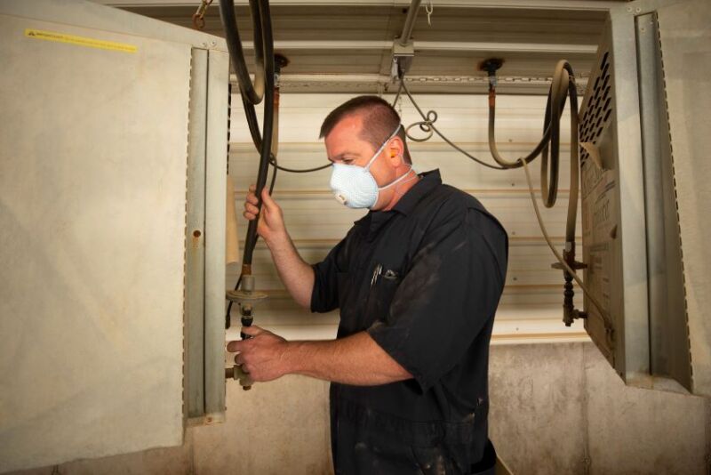Caretaker checking heater