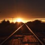 railroad train tracks sunset by Lindsey Pound