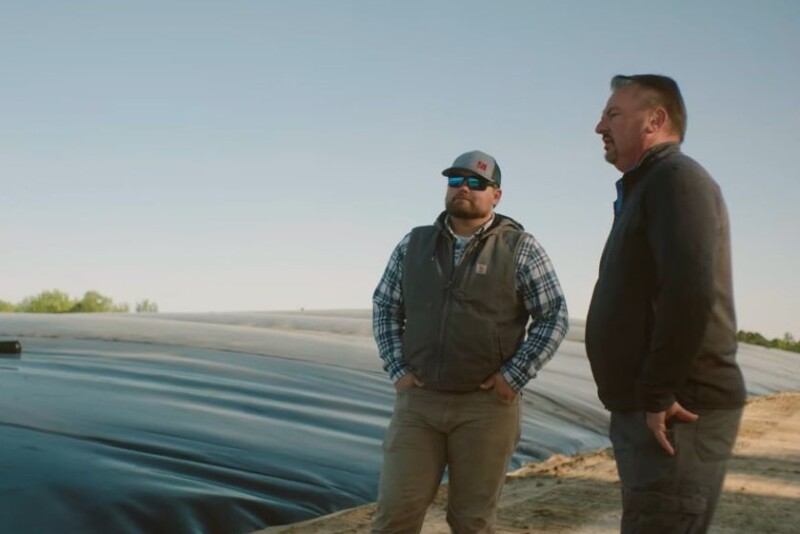 Wen Murphy and UC Davis Professor Frank Mitloehner next to anaerobic digester on a swine farm.