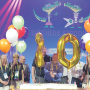 David Sherrod (center), president and CEO of the Southeast Produce Council, cuts a cake with a sword at last year’s Southern Exposure to celebrate the 20th anniversary of the show.