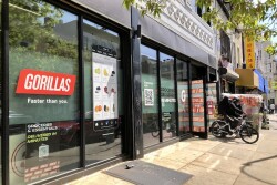 bike rider leaves Gorillas dark store warehouse in NYC New York City ultra fast rapid grocery delivery service app