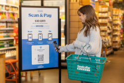 woman scanning a qr code at grocery store