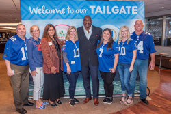 Members of the Eastern Produce Council and representatives from the Idaho Potato Commission and Avocados from Mexico flank former New York Giants defensive end George Martin at the group's 2nd-annual Tailgate event Sept. 25.