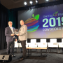  The Packer's editor-in-chief Tom Karst presents the 2019 Packer Man of the Year award to Grimmway president Jeff Huckaby. 