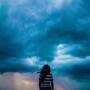 woman looking at stormy sky unsplash shashank sahay