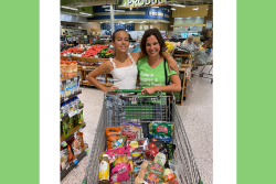 mom and daughter shopping cart in grocery store