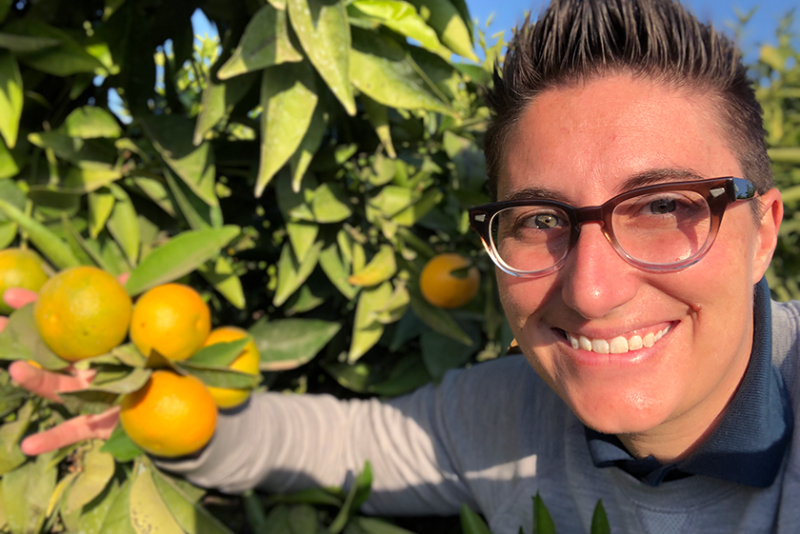 Fruit World founder and CEO Bianca Kaprielian checks out mandarins.