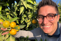 Fruit World founder and CEO Bianca Kaprielian checks out mandarins.