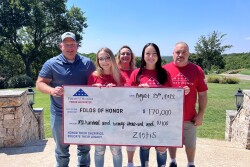 Pictured in the check presentation photo: