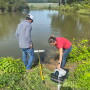 Two people conducting research in ag water