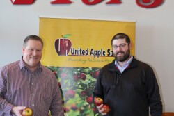 Tops Friendly Markets executives Jeff Cady (from left), director of produce and floral, and Justin Rowe, produce category business manager, market EverCrisp apples, a late-season special variety made from a cross between a Honeycrisp and a fuji.