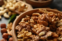 Shelled walnuts in a wooden bowl