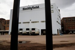 Workers walk out of Smithfield Foods pork plant in Sioux Falls, S.D., (April 16, 2020) as the spread of the coronavirus disease continues.