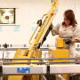 A worker operates the Hercules Arm