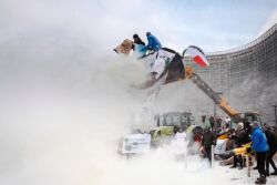 European dairy farmers spray the EU Council building with milk powder to protest the crisis in their sector, in Brussels on Monday, Jan. 23, 2017.