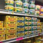 Butter on a shelf at a grocery store. 