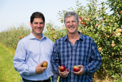 Left to right, Don Roper, vice president sales and marketing, Fred Wescott, president, Honeybear Brands in one of Honeybear’s many varietal development grower orchards