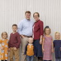 The Mogler family's journey to provide foster care has been life-changing for their entire family. From left are Poppy, Brecken, Chet, Kalvin, Cassie, Lily and Daphne Mogler.