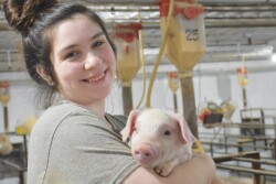 Lidia Williams holding piglet
