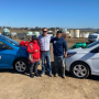 RC Jones (center), managing member of Bobalu Berry Farms, with workers Guillermo and Eva, who won cars at the company's end-of-season celebration for strawberries.