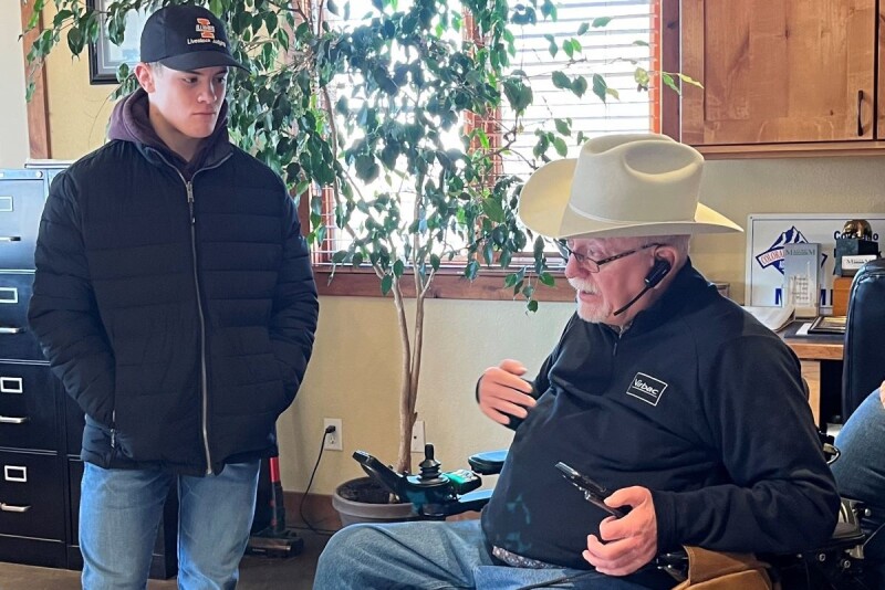 Hunter Shike listening to Steve Gabel of Magnum Feedyard
