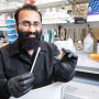 Mohit Verma, professor of agricultural and biological engineering in Purdue University’s College of Agriculture, holds a prototype for a low-cost test to diagnose COVID-19 in animals.
