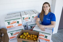 Christa Court, an economist with the University of Florida Institute of Food and Agricultural Sciences, poses with freshly harvested oranges at a student citrus sale event on the UF main campus in Gainesville -- Friday, Dec. 7, 2018. Court is part of a team that produced a new report on the economic contributions of Florida's citrus industry in the 2016-17 growing season. Total economic contributions, including multiplier effects, include $7.241 billion in industry output (sales revenue) and more than 50,000 jobs