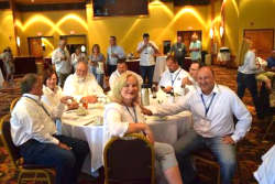 Paula Houlihan, front-center, and Wisconsin Potato & Vegetable Growers Association executive director Tamas Houlihan, right, enjoy festivities at the National Potato Council summer meeting in July in Wisconsin Dells, Wisc.