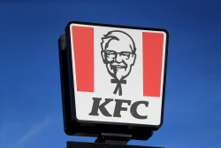PA via Reuters A view of the sign at a KFC restaurant and drive-thru