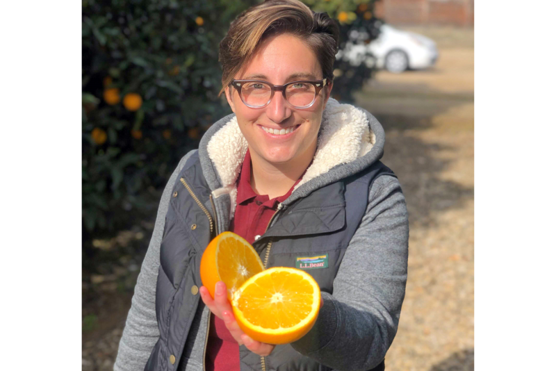 Bianca Kapreilian, CEO and co-founder of Fruit World, Reedly, Calif., with a navel orange.