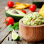 The guacamole can get a bit thicker this year as avocado prices are down 20% from a year ago.