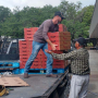 The USDA's plan is designed to find charitable outlets for fresh fruits and vegetables, dairy and meat. In this file photo, Chris Parks (left), farm manager for Wish Farms, helps unload pallets of strawberries at one donation to food banks in the Plant City, Fla., area.