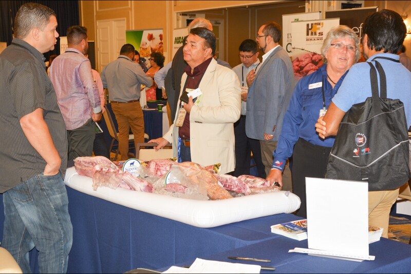 Elizabeth Wunderlich (second from the right), USMEF representative in the Caribbean, answers questions from a buyer during the 2019 Latin American Product Showcase in San Juan, Puerto Rico.