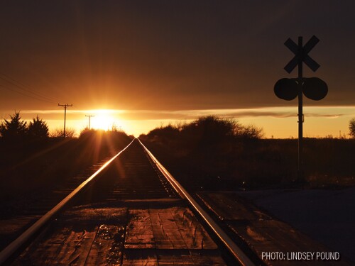 railroad train tracks sunset by Lindsey Pound