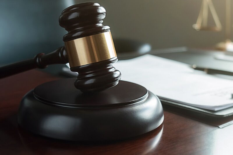 Photo of gavel and file in a courtroom