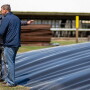 UC Davis Professor, Frank Mitloehner next to anaerobic digester on a swine farm.