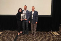Dr. Tye Perrett (center) was named consultant of the year by the Academy of Veterinary Consultants for 2021. With him is his wife, Tanya. The honor was presented to Dr. Perrett by Mitch Blanding (right), Zoetis associate director for beef technical services. Zoetis sponsors the annual award. 
